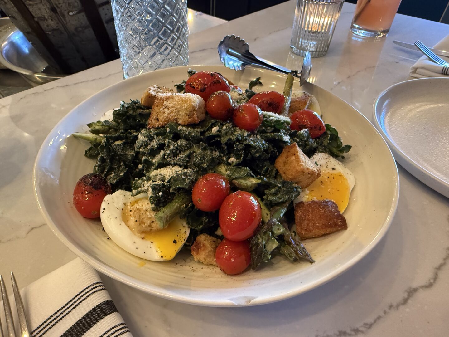 Fresh greens and red tomatoes on a plate