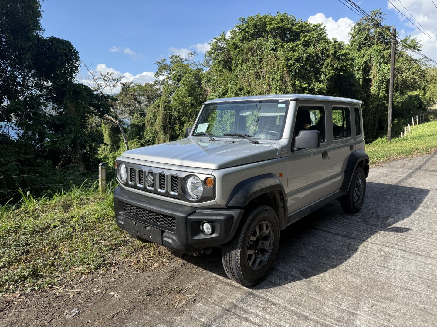 Vamos Rent-A-Car parked on side of the road