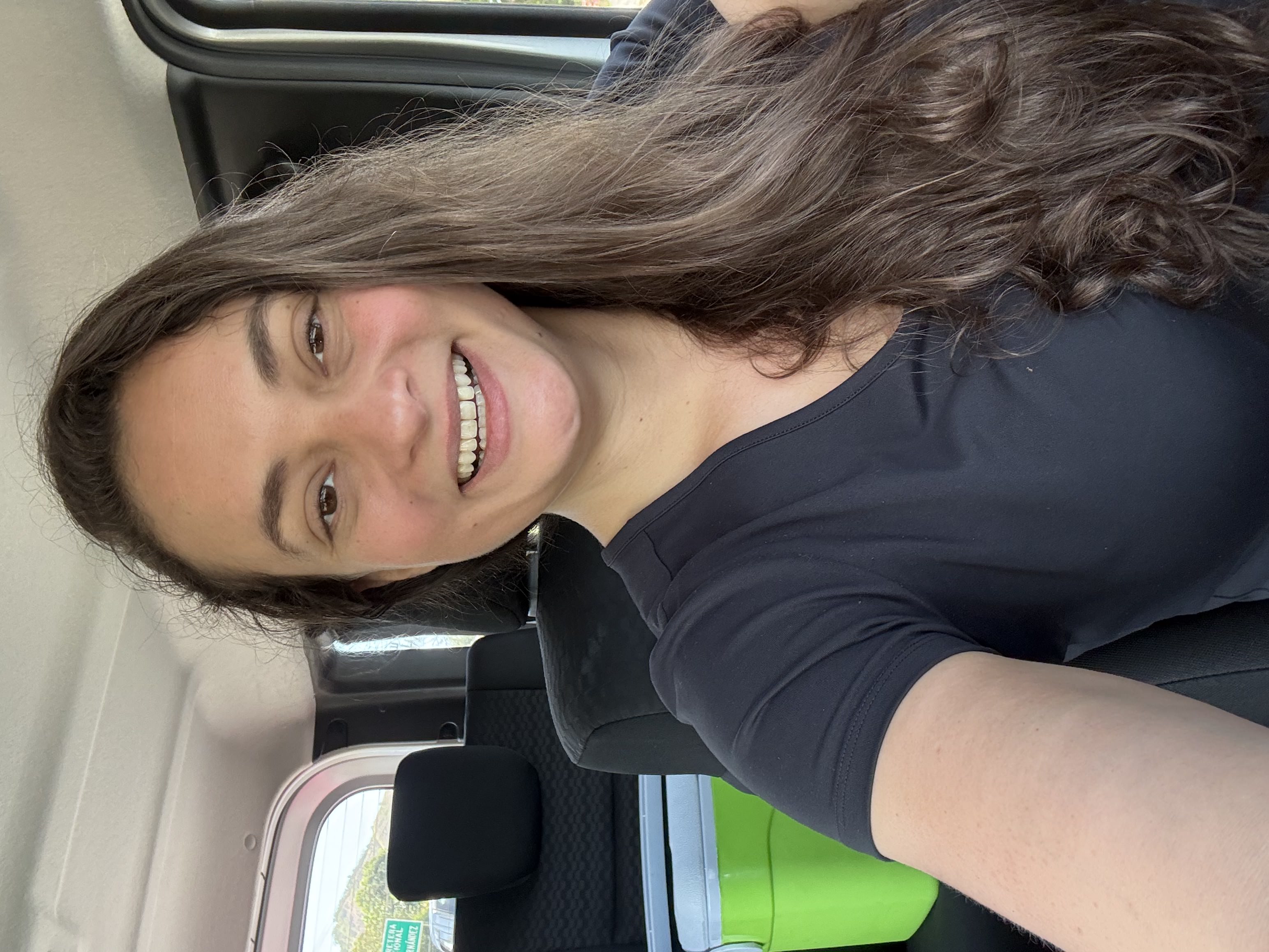 Driving in Vamos compact SUV with cooler in back seat