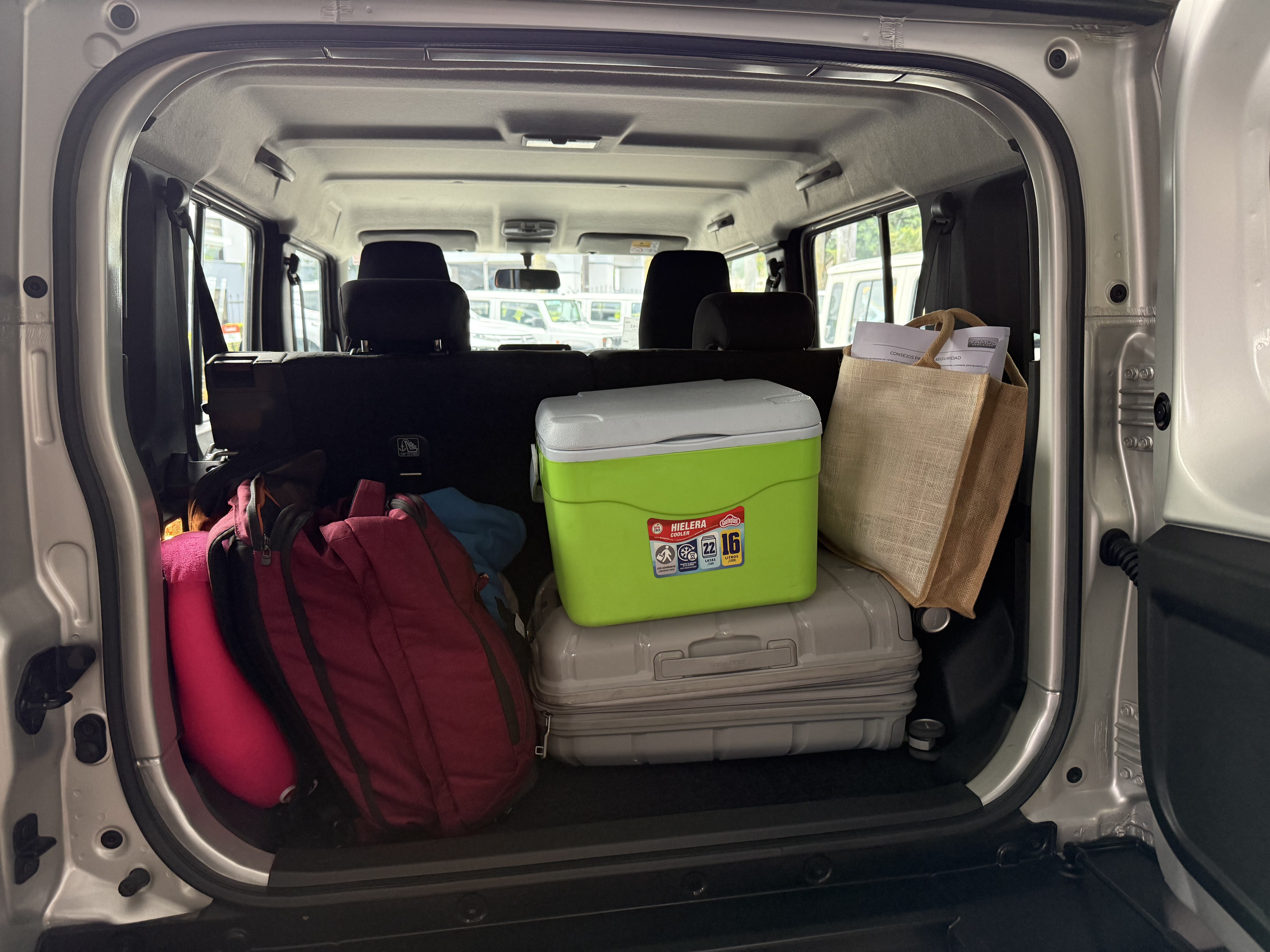 Back of Vamos car rental filled with luggage
